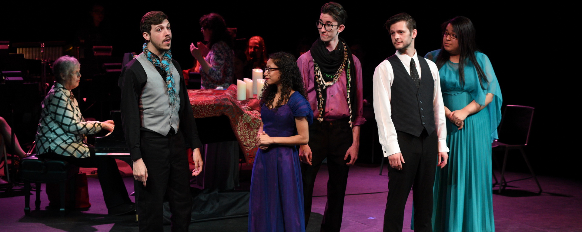 players singing in a musical production